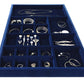 Navy blue velvet custom jewelry drawer insert filled with rings, bracelets, necklaces and earrings